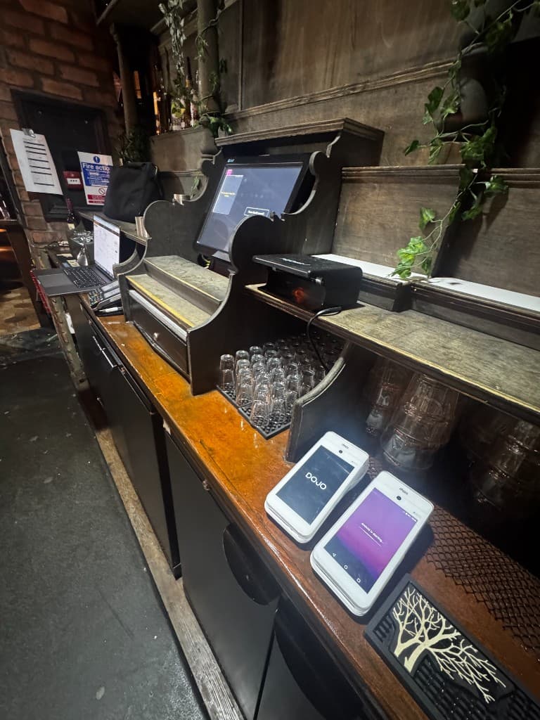 Craft beer bar staff with a Dojo terminal
